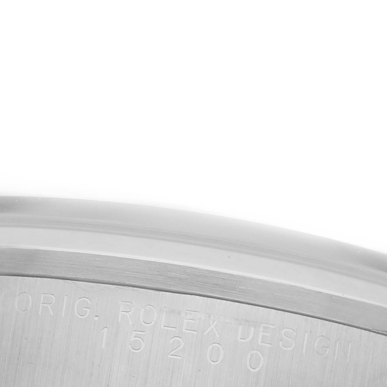 The image shows a close-up angle of the case back edge on a Rolex Date 15200 Men's Stainless Steel Blue Dial 15200 Men's Stainless Steel Blue Dial model, displaying engravings.