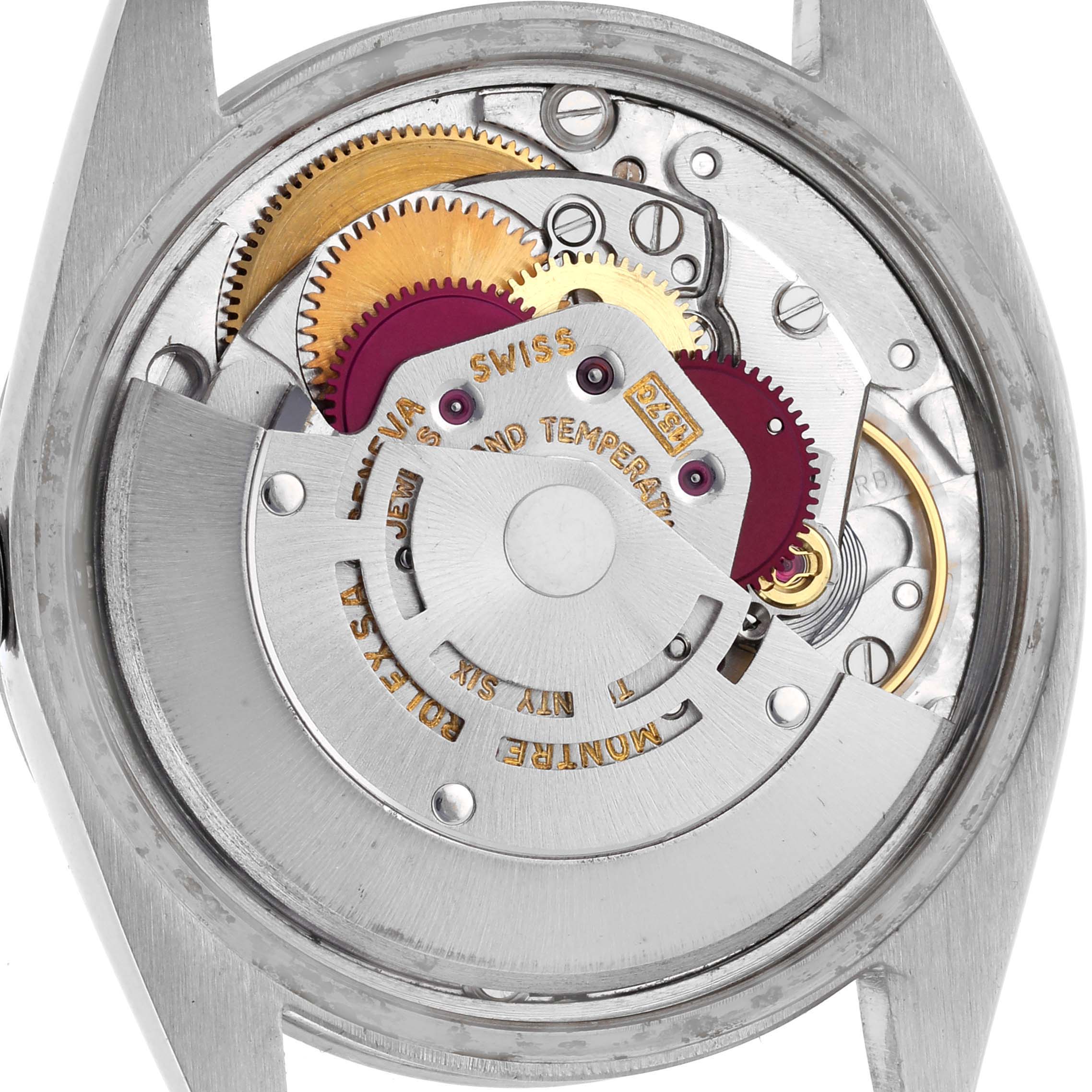 This image shows the movement of a Rolex Date 1501 Men's Stainless Steel Silver Dial 1501 Men's Stainless Steel Silver Dial watch from the back, highlighting the gears and rotor.