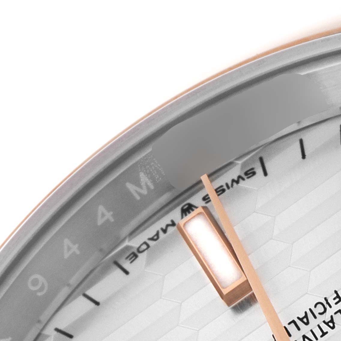 This image shows a close-up of the dial and hands of a Rolex Datejust 126201 Men
s Steel and Gold (two tone) Silver Dial 126201 Men
s Steel and Gold (two tone) Silver Dial watch.