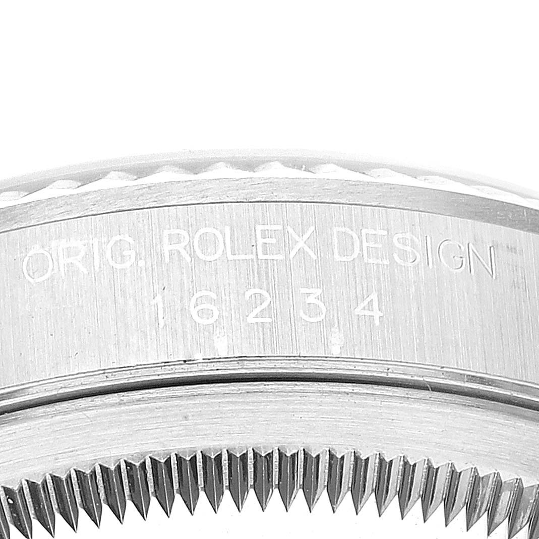 This close-up image shows the side of a Rolex Datejust 16234 Men's Stainless Steel Blue Dial 16234 Men's Stainless Steel Blue Dial model, highlighting the engraved reference number and part of the bezel.