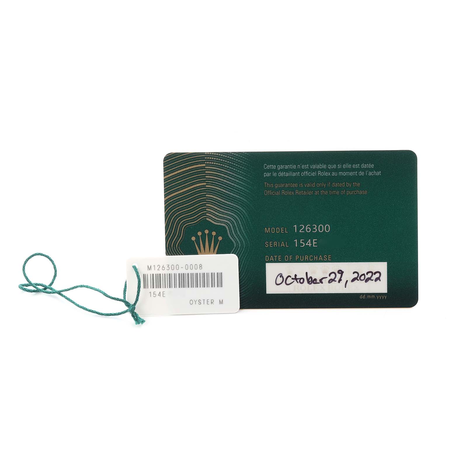 The image shows a green warranty card and a tag for the Rolex Datejust 41 126300 Men's Stainless Steel Grey Dial 126300 Men's Stainless Steel Grey Dial, displaying model and serial numbers.
