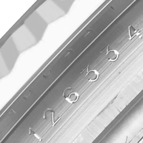 This image shows a close-up of the Rolex Datejust 41 126334 Men's Stainless Steel Grey Dial 126334 Men's Stainless Steel Grey Dial bezel and engraved serial numbers at an angled perspective.