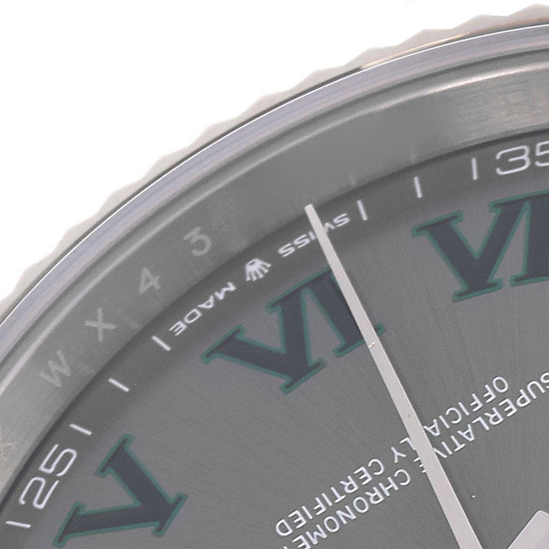 The image shows a close-up of the Rolex Datejust 41 126334 Men's Stainless Steel Grey Dial 126334 Men's Stainless Steel Grey Dial, featuring a portion of the dial with Roman numerals and part of the minute hand.