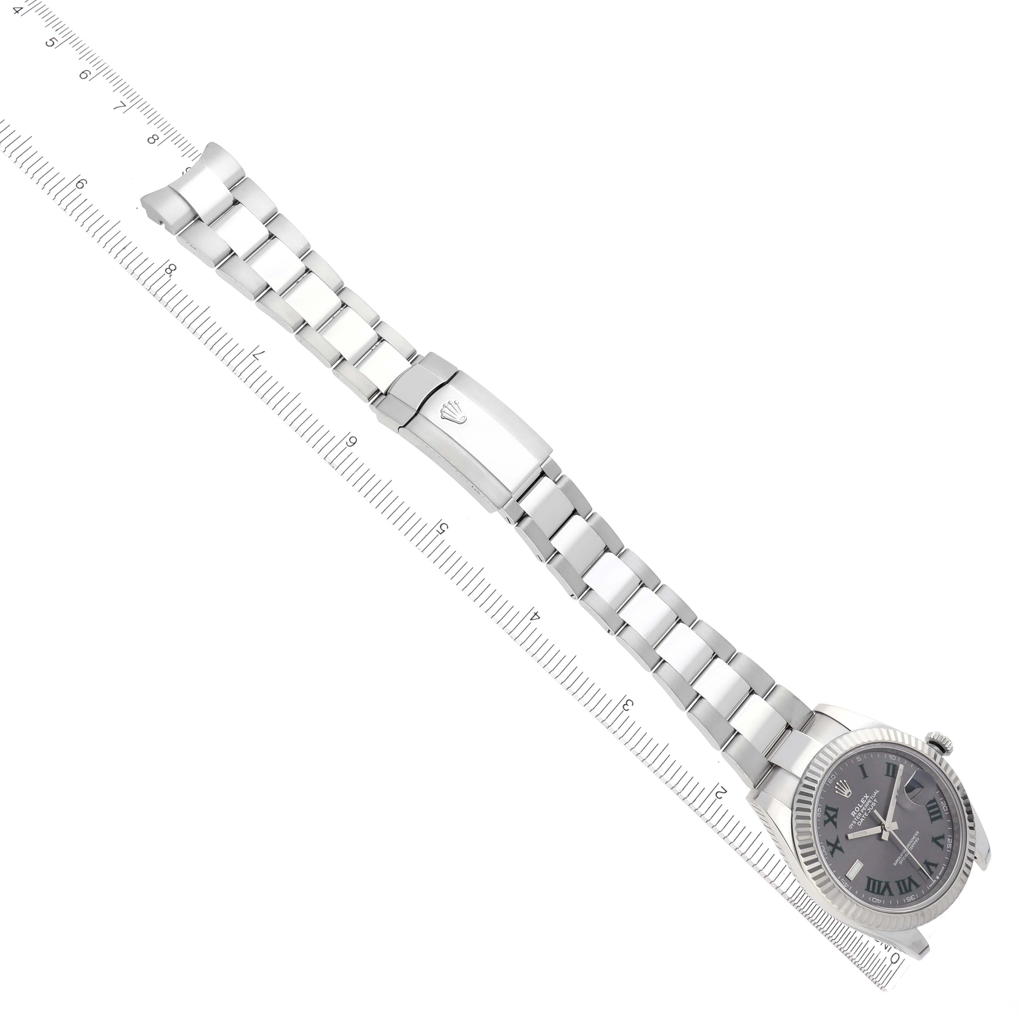 The Rolex Datejust 41 126334 Men's Stainless Steel Grey Dial 126334 Men's Stainless Steel Grey Dial is shown from an angled top view, displaying its full bracelet and face along with the clasp and ruler for scale.
