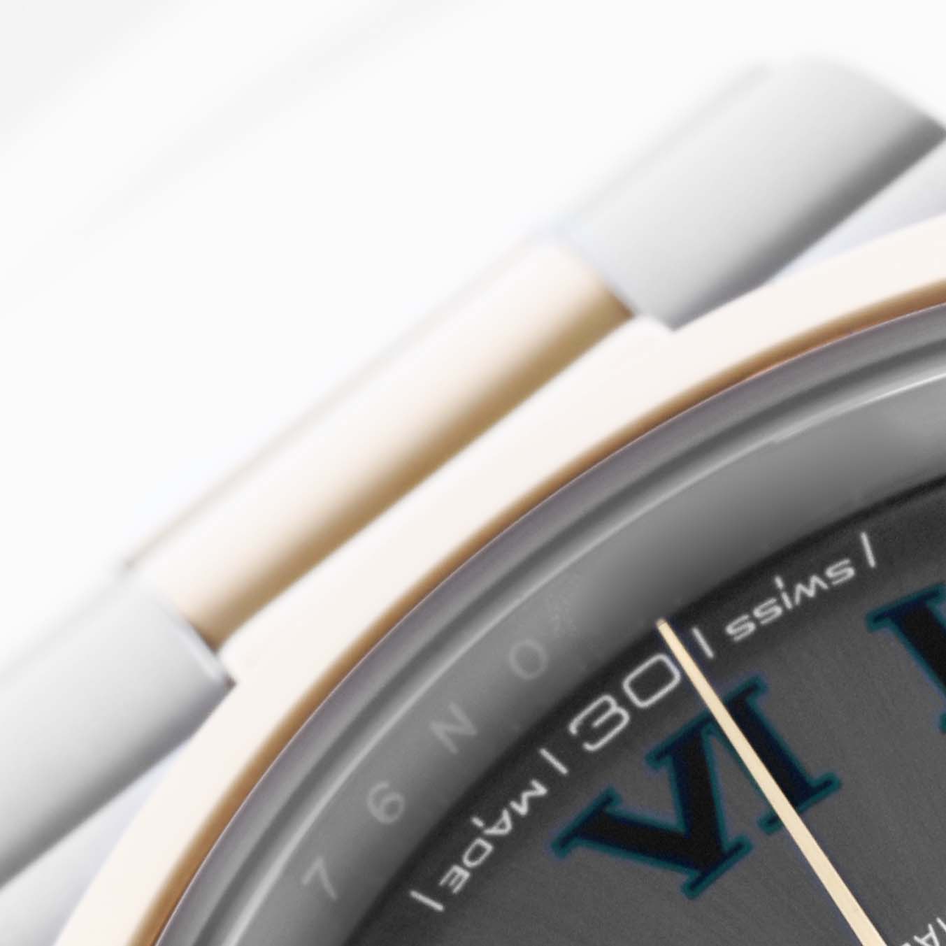 The image shows a close-up of the dial, bezel, and part of the bracelet of a Rolex Datejust 41 126303 Men's Steel and Gold (two tone) Grey Dial 126303 Men's Steel and Gold (two tone) Grey Dial.