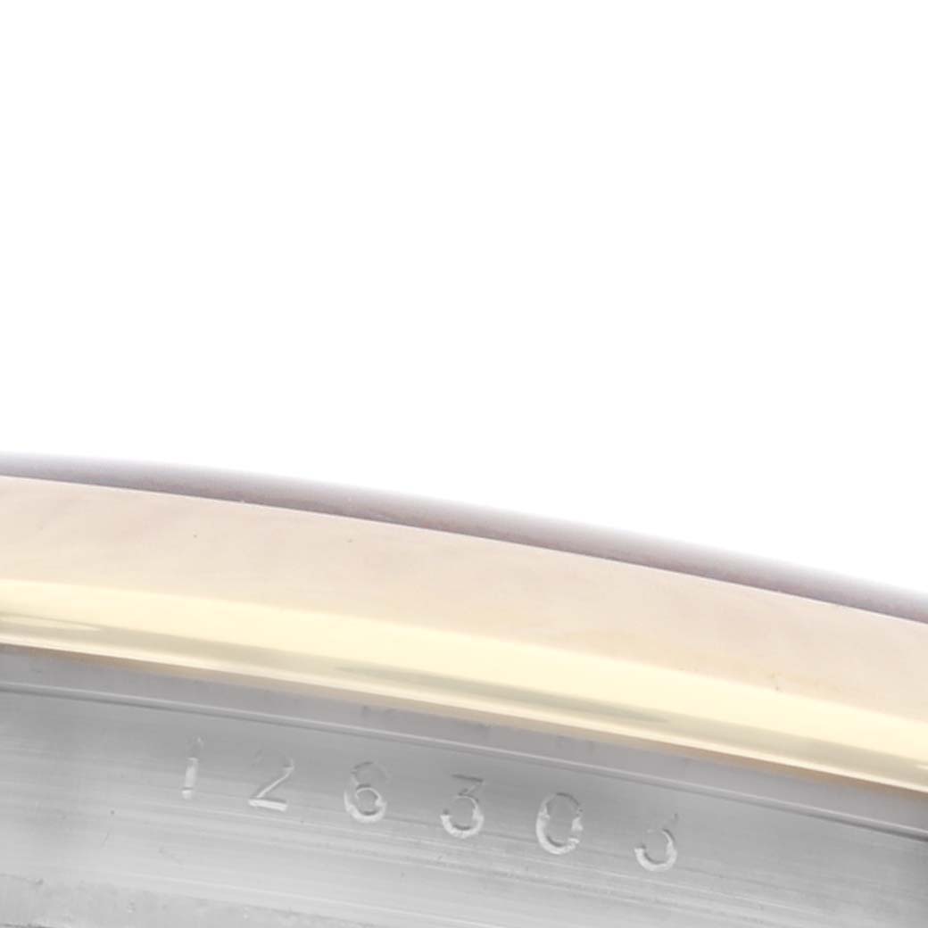 This image shows a close-up of the bezel and part of the engraved inner rim of the Rolex Datejust 41 126303 Men's Steel and Gold (two tone) Grey Dial 126303 Men's Steel and Gold (two tone) Grey Dial watch.