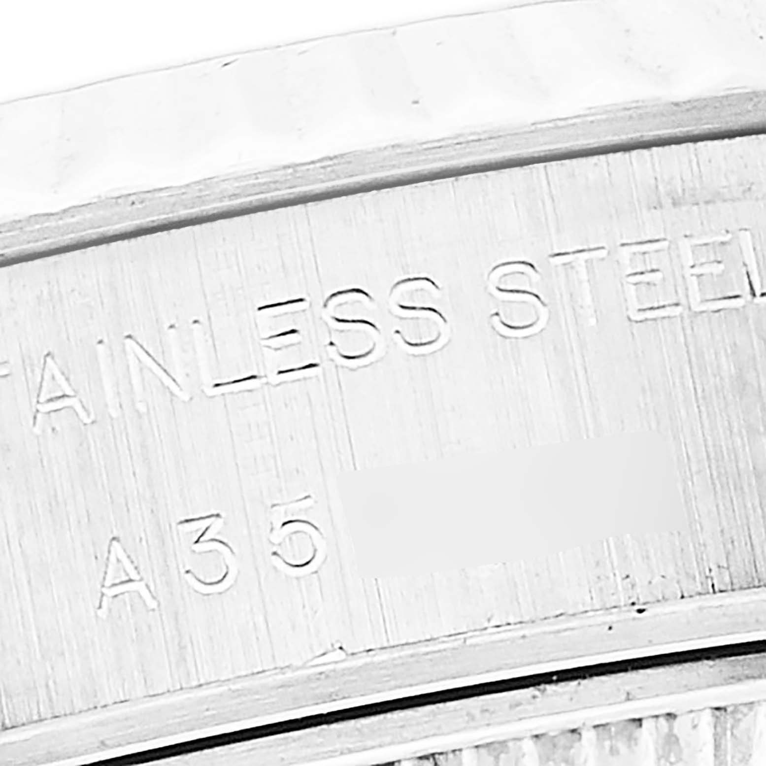 This is a close-up shot of the case side of a Rolex Datejust 79174 Women's Stainless Steel Mother of Pearl Dial 79174 Women's Stainless Steel Mother of Pearl Dial watch, showing the "Stainless Steel" engraving.