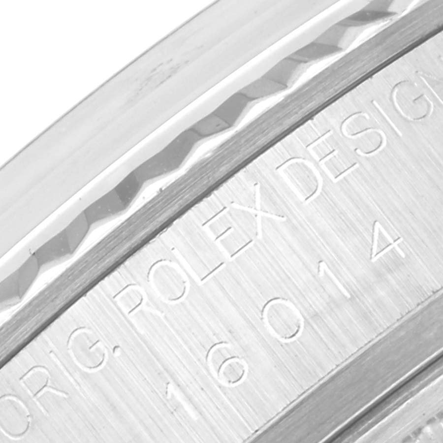 This close-up image shows the engraved bezel of a Rolex Vintage Collection 16014 Men's Stainless Steel Silver Dial 16014 Men's Stainless Steel Silver Dial model, displaying part of the model number.