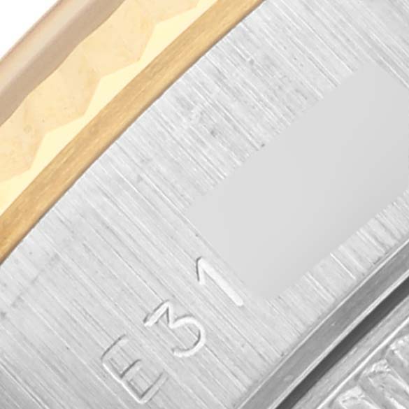 The image shows a close-up of the side edge and part of the bezel of a Rolex Datejust 69173 Women's Steel and Gold (two tone) Champagne Dial 69173 Women's Steel and Gold (two tone) Champagne Dial watch.