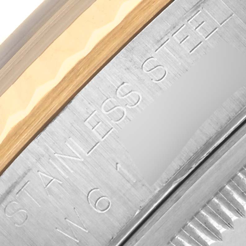 The image shows a close-up of the case edge with the "STAINLESS STEEL" engraving on a Rolex Datejust 16233 Men's Steel and Gold (two tone) Black Dial 16233 Men's Steel and Gold (two tone) Black Dial.