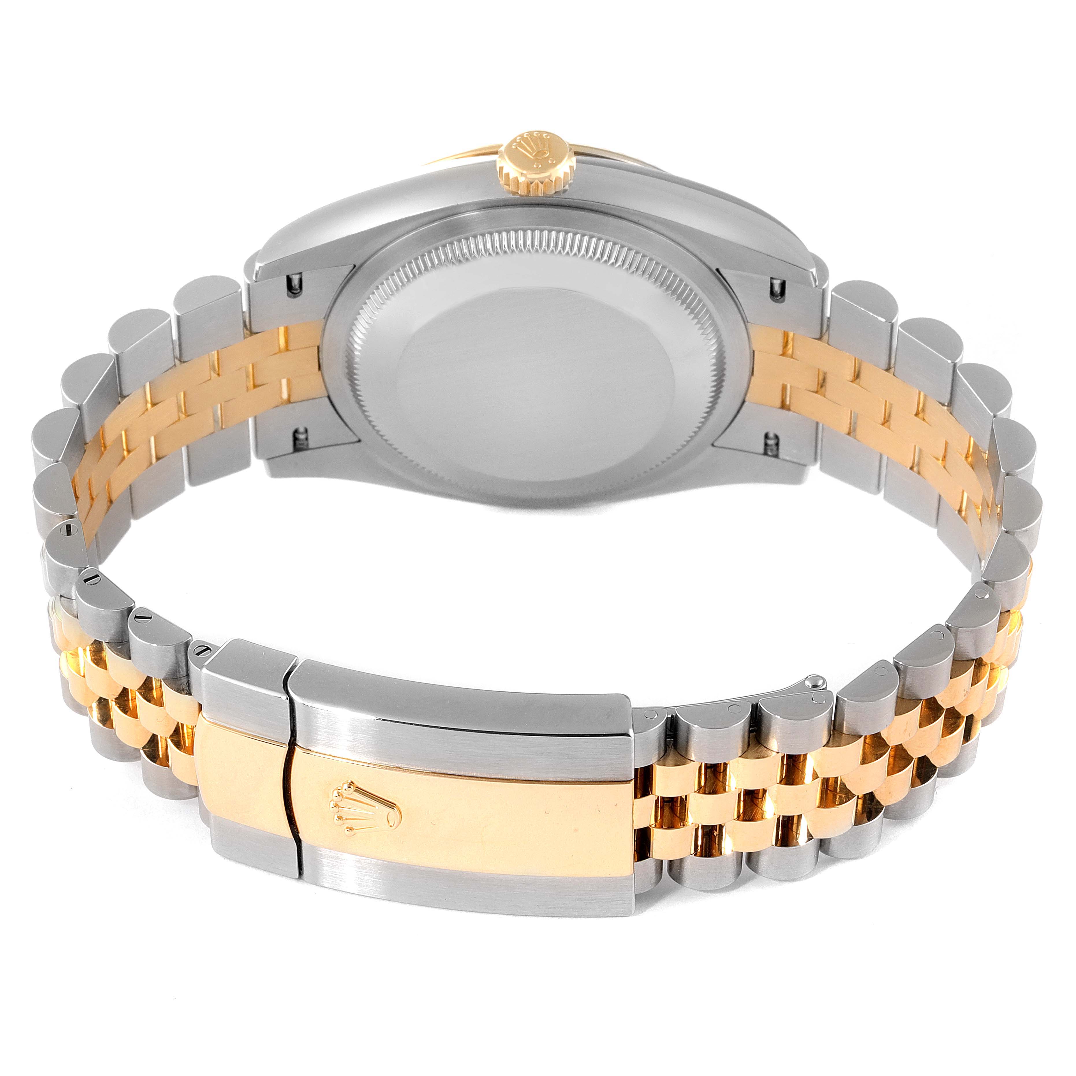 The image shows the back view of a Rolex Datejust 126233 Men
s Steel and Gold (two tone) Champagne Dial 126233 Men
s Steel and Gold (two tone) Champagne Dial watch, highlighting its two-tone bracelet and clasp.
