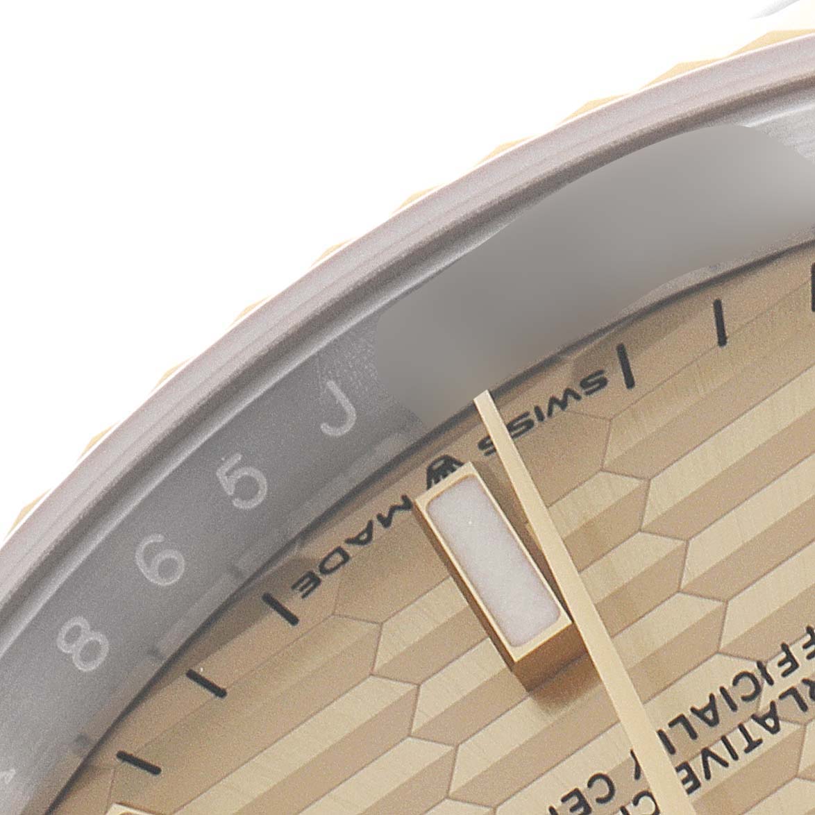 This close-up shows the dial and part of the bezel of a Rolex Datejust 126233 Men
s Steel and Gold (two tone) Champagne Dial 126233 Men
s Steel and Gold (two tone) Champagne Dial watch, highlighting the hour markers and minute track.
