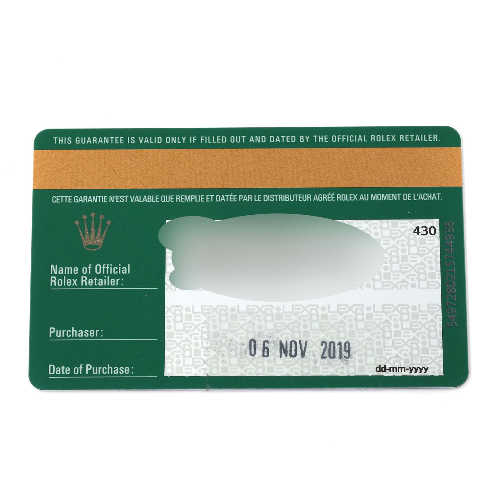 The image shows a Datejust model Rolex warranty card viewed from a top-down angle.