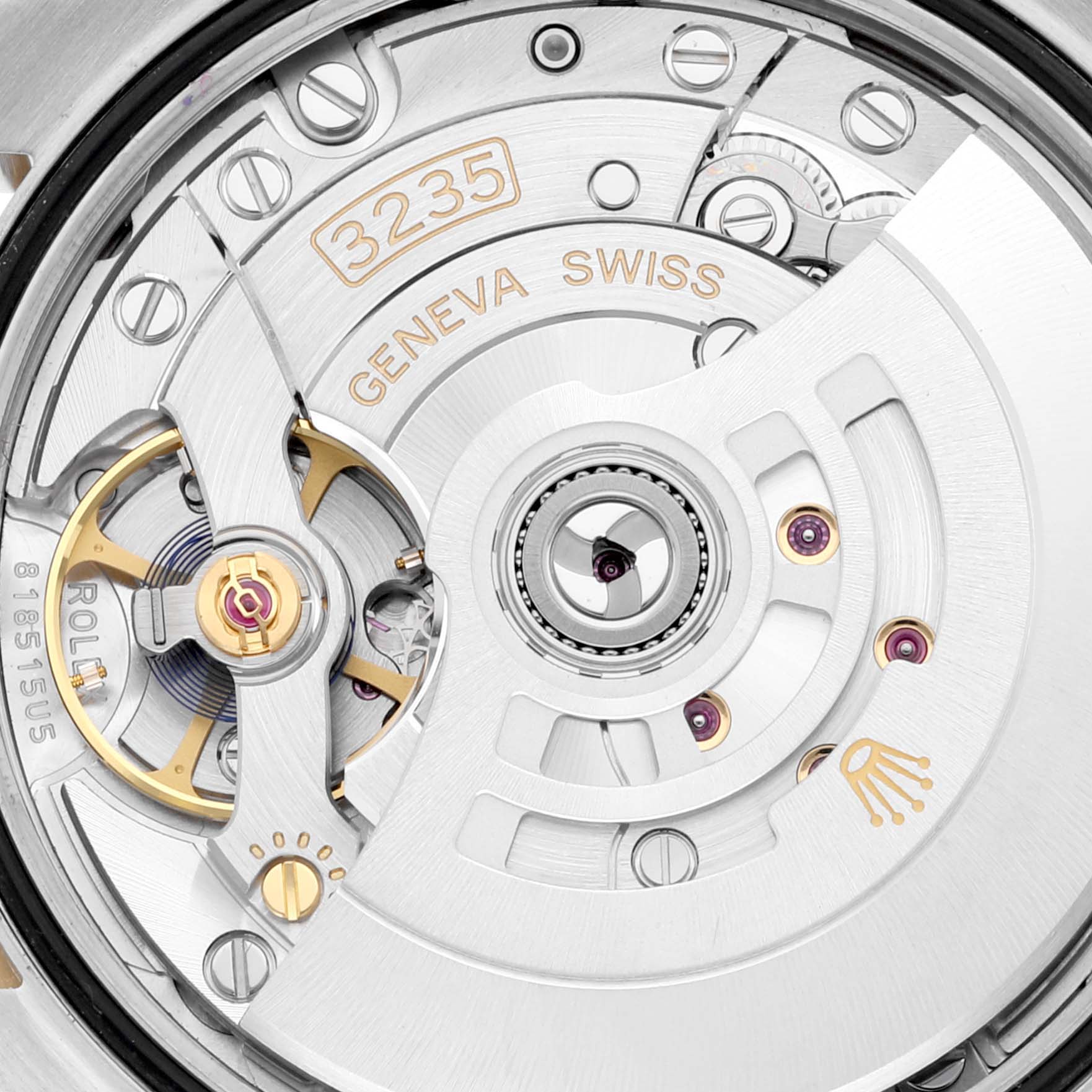 This image shows an up-close view of the movement and intricate inner components of a Rolex Datejust 126233 Men's Steel and Gold (two tone) Green Dial 126233 Men's Steel and Gold (two tone) Green Dial watch model.