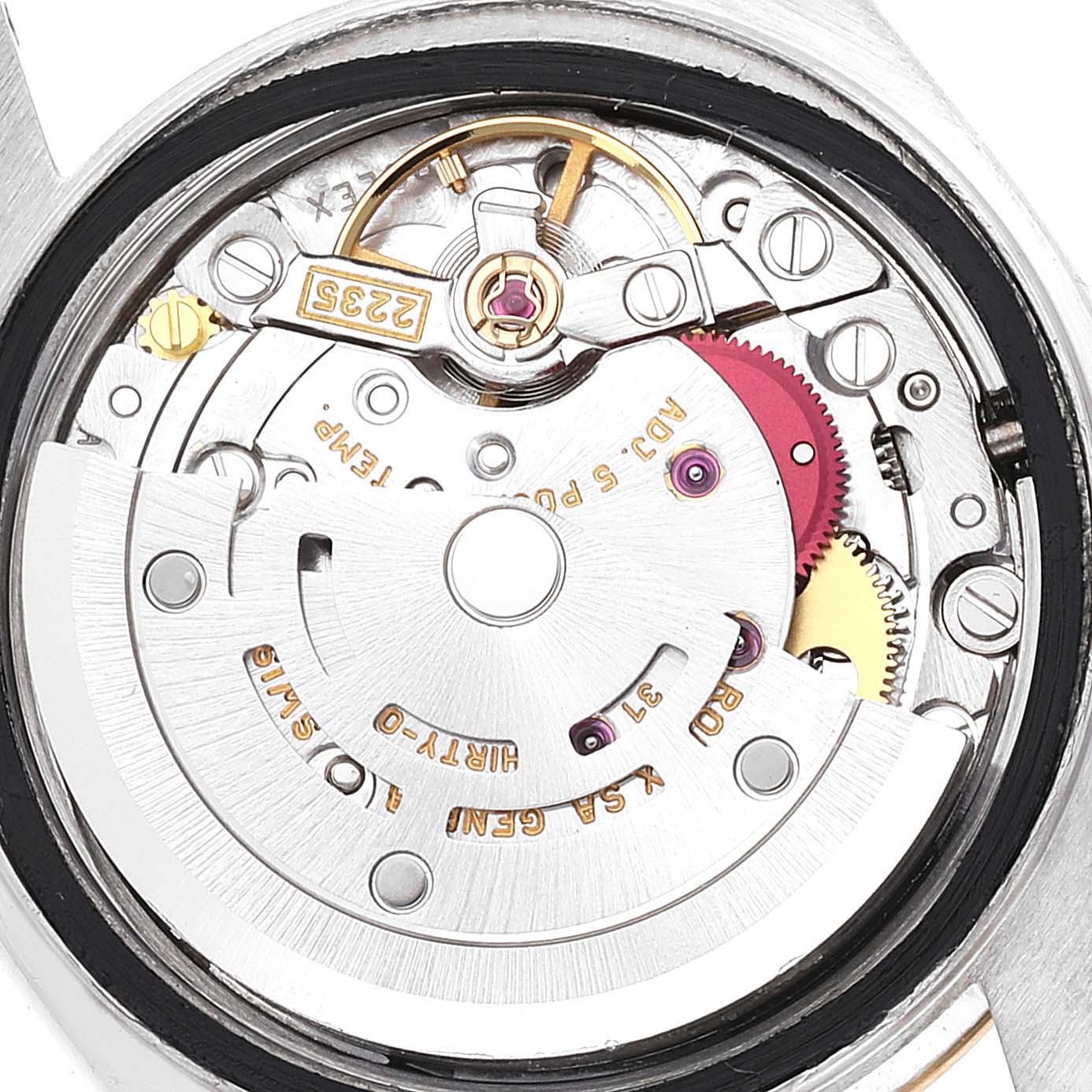The image shows an angled close-up of the movement inside a Rolex Datejust 79173 Women's Steel and Gold (two tone) Silver Dial 79173 Women's Steel and Gold (two tone) Silver Dial watch, revealing internal gears and mechanisms.