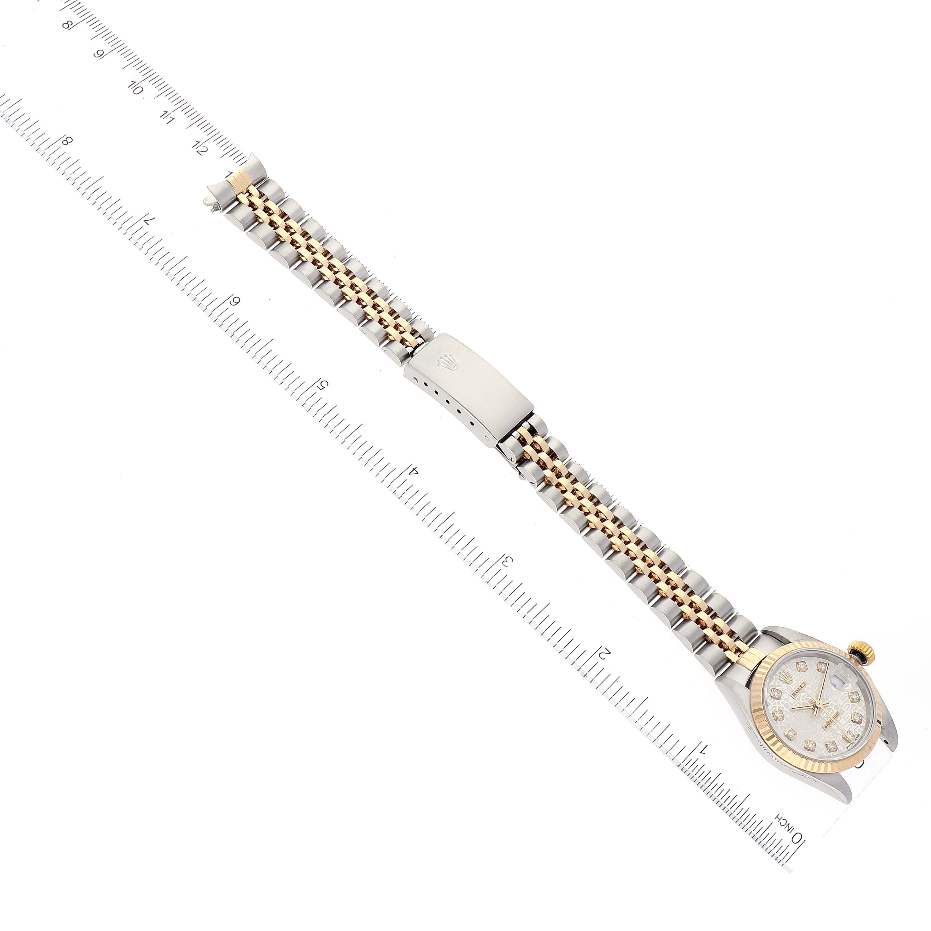 The image shows a top-down view of a Rolex Datejust 79173 Women's Steel and Gold (two tone) Silver Dial 79173 Women's Steel and Gold (two tone) Silver Dial watch with its clasp, bracelet, and dial visible.