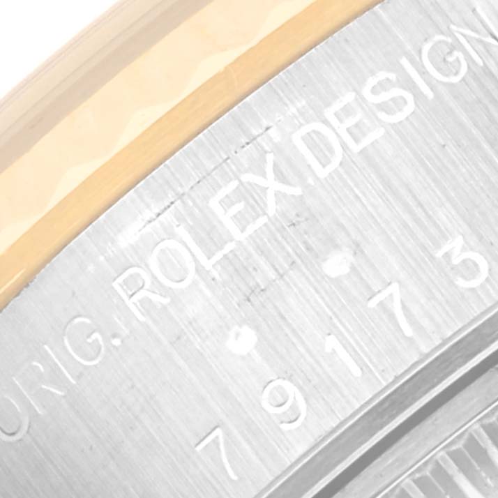 This image shows a close-up of the engraved case back of a Rolex Datejust 79173 Women's Steel and Gold (two tone) Grey Dial 79173 Women's Steel and Gold (two tone) Grey Dial watch, highlighting the brand and model information.