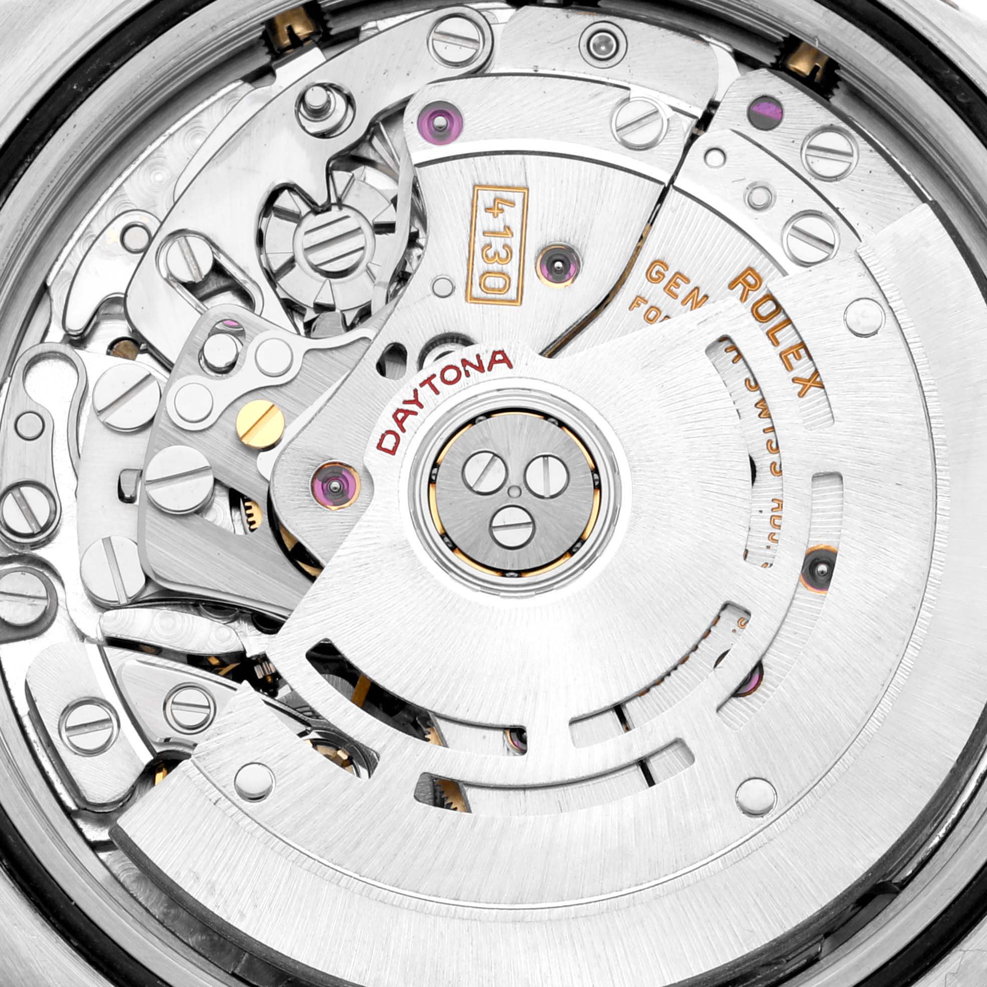 This image shows a close-up view of the movement mechanism of a Rolex Daytona 116523 Men's Steel and Gold (two tone) Mother of Pearl Dial 116523 Men's Steel and Gold (two tone) Mother of Pearl Dial watch, highlighting its intricate internal components.