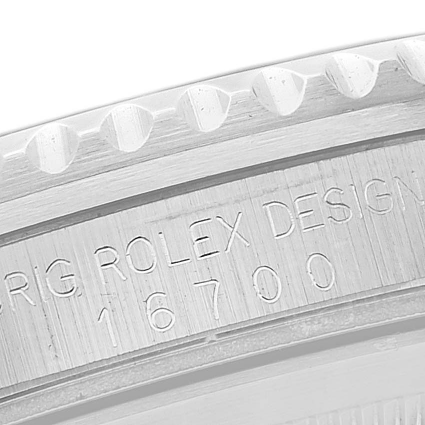 This close-up angle shows the outer edge and engraved model number of the Rolex GMT-Master 16700 Men
s Stainless Steel Black Dial 16700 Men
s Stainless Steel Black Dial.