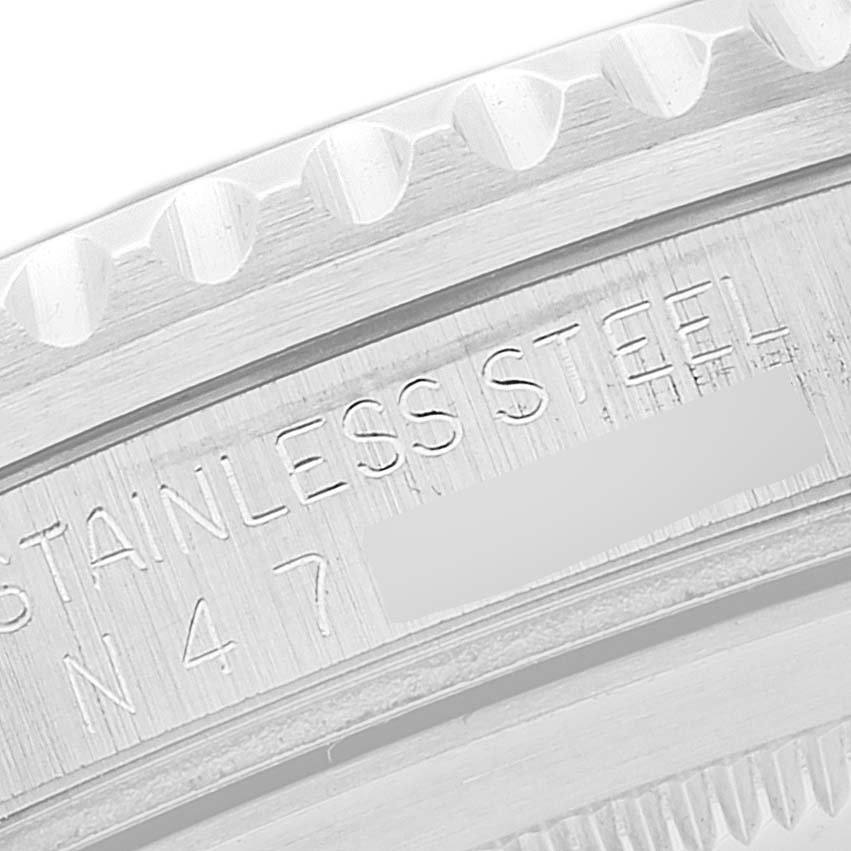 The image shows a close-up of the bezel and serial number engraving of a Rolex GMT-Master 16700 Men
s Stainless Steel Black Dial 16700 Men
s Stainless Steel Black Dial.