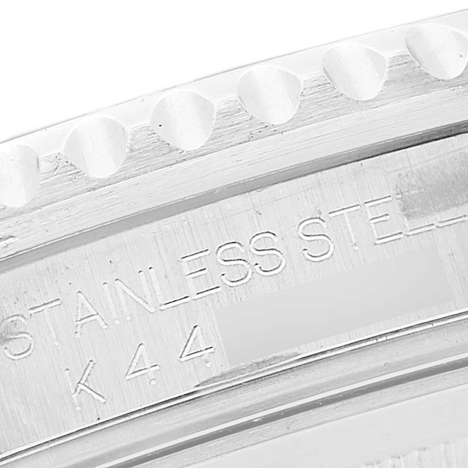 This image shows a close-up of the case back and bezel edge of a Rolex GMT-Master 16710 Men's Stainless Steel Black Dial 16710 Men's Stainless Steel Black Dial watch, highlighting its stainless steel engraving.