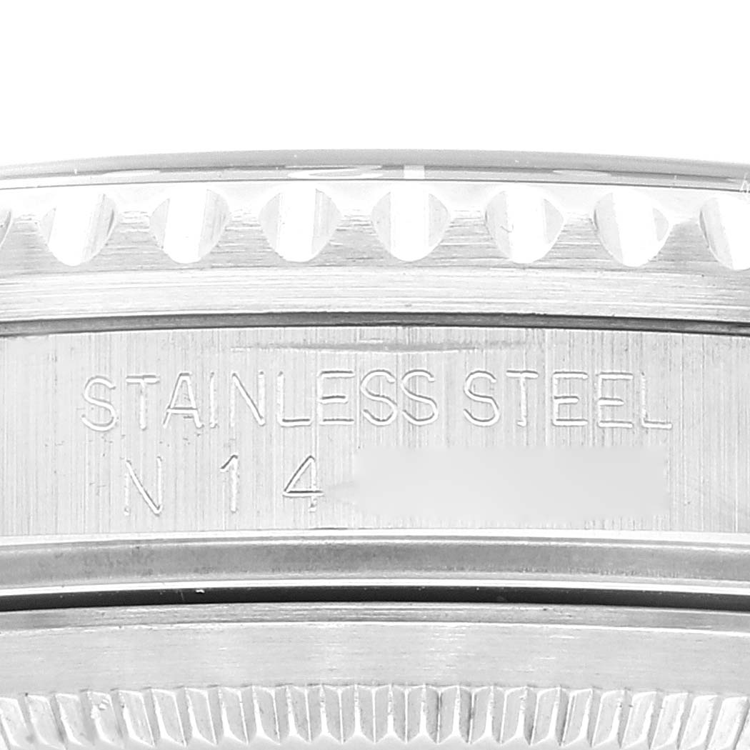 This image shows a close-up of the case side and bezel engraving on a Rolex GMT-Master 16710 Men
s Stainless Steel Black Dial 16710 Men
s Stainless Steel Black Dial watch, highlighting the "STAINLESS STEEL" text.