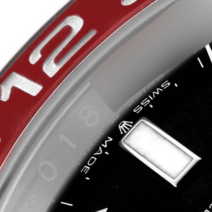 The image shows a close-up of the bezel and dial of a Rolex GMT-Master 126710BLRO Men's Stainless Steel Black Dial 126710BLRO Men's Stainless Steel Black Dial watch, highlighting the red bezel insert and part of the black dial.