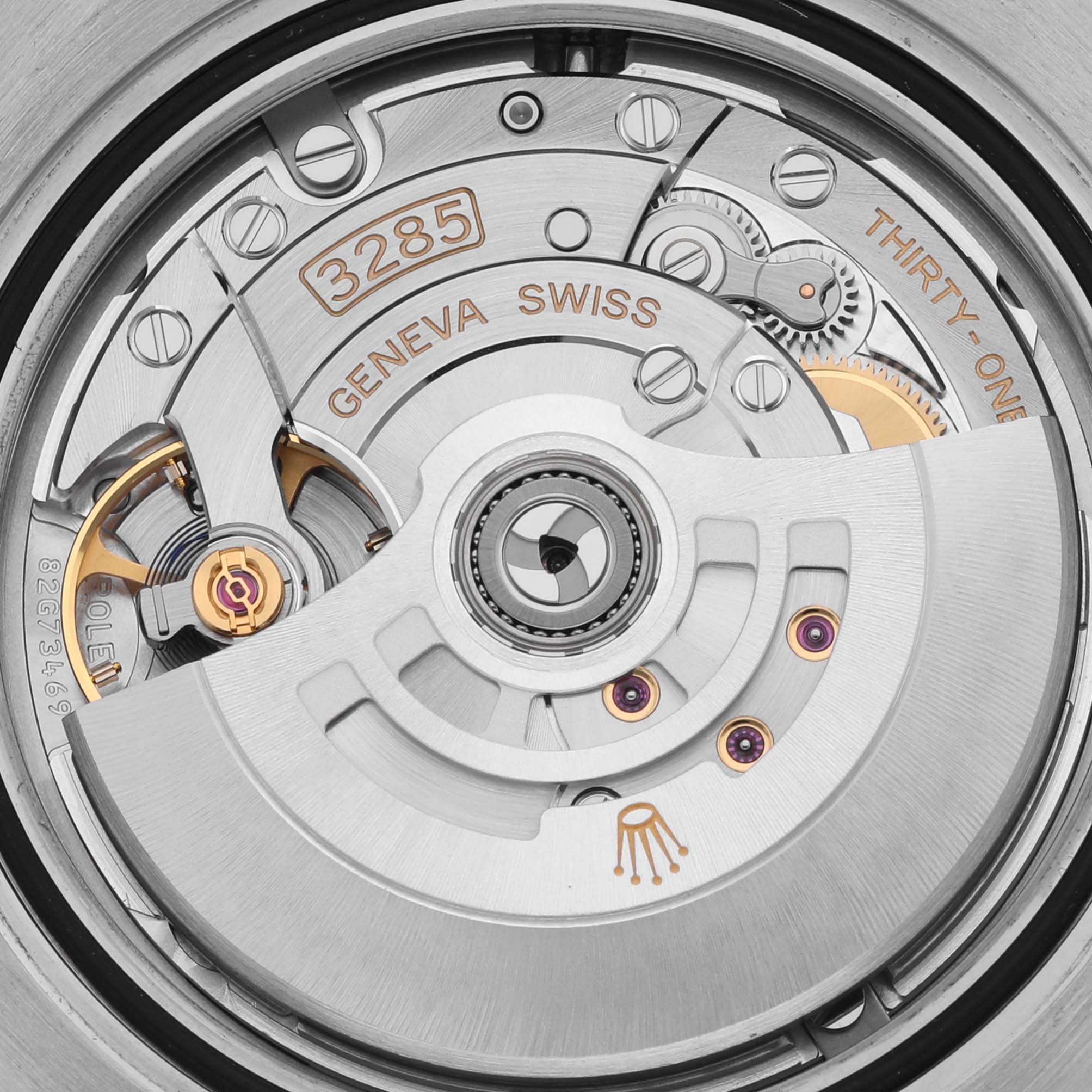 The image shows the movement of a Rolex GMT-Master 126710BLRO Men's Stainless Steel Black Dial 126710BLRO Men's Stainless Steel Black Dial, highlighting the rotor, gears, and inscriptions from a top-down angle.