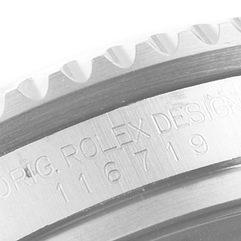 The image shows a close-up of the case and bezel, displaying the model number and "ROLEX DESIGN" engraving on a Rolex GMT-Master 116719 Men's White Gold Black Dial 116719 Men's White Gold Black Dial.