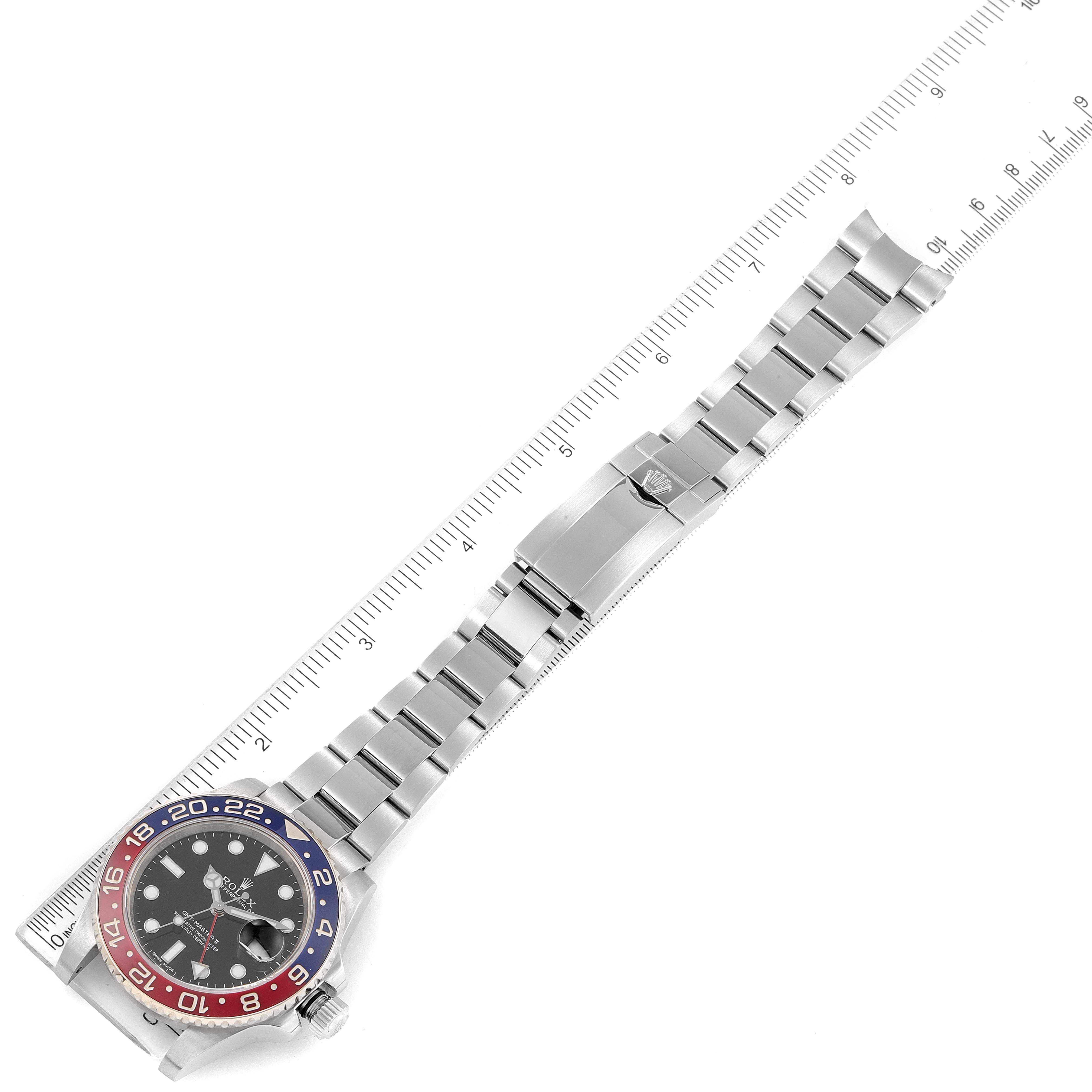 The image shows a Rolex GMT-Master 116719 Men's White Gold Black Dial 116719 Men's White Gold Black Dial watch lying flat, highlighting the bezel, dial, bracelet, and clasp with a measuring ruler.