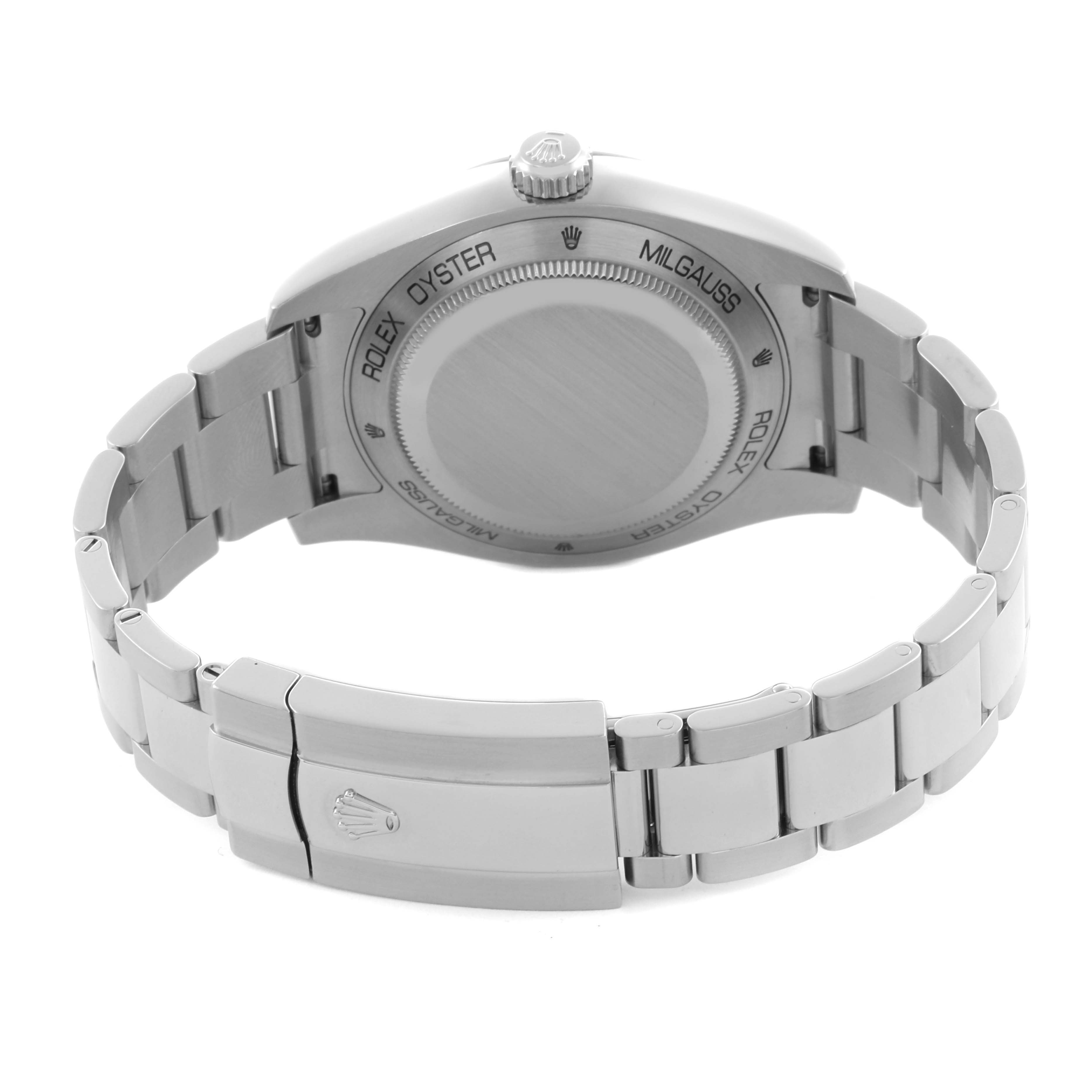 The image shows the rear view of a Rolex Milgauss 116400GV Men's Stainless Steel Black Dial 116400GV Men's Stainless Steel Black Dial watch, highlighting its case back, crown, and bracelet clasp.