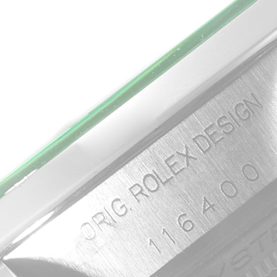 The image shows a close-up of the Rolex Milgauss 116400V Men's Stainless Steel Black Dial 116400V Men's Stainless Steel Black Dial model's case side, highlighting the engraved model number and design details.