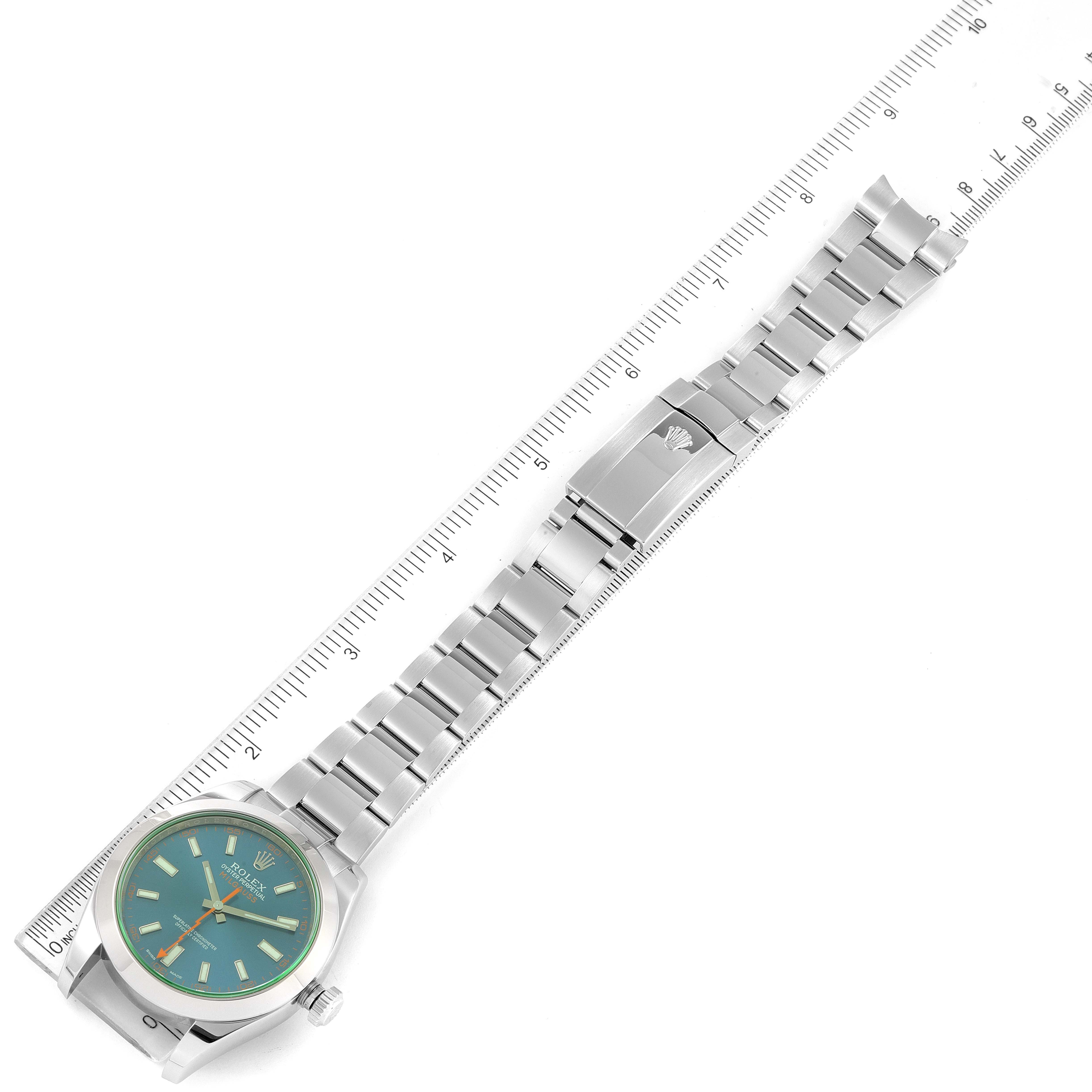 This image shows a Rolex Milgauss 116400GV Men's Stainless Steel Blue Dial 116400GV Men's Stainless Steel Blue Dial watch lying flat, displaying its face, bezel, bracelet, and clasp along with a ruler for size reference.