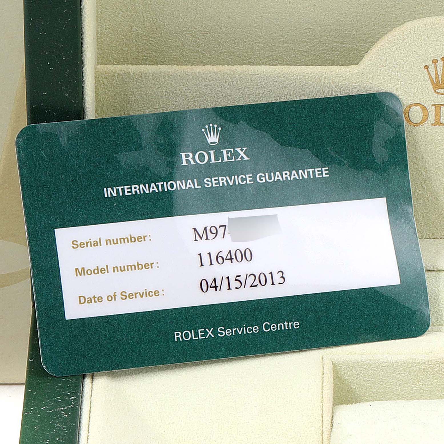 The image shows a Rolex International Service Guarantee card for the Rolex Milgauss 116400V Men's Stainless Steel White Dial 116400V Men's Stainless Steel White Dial model 116400.