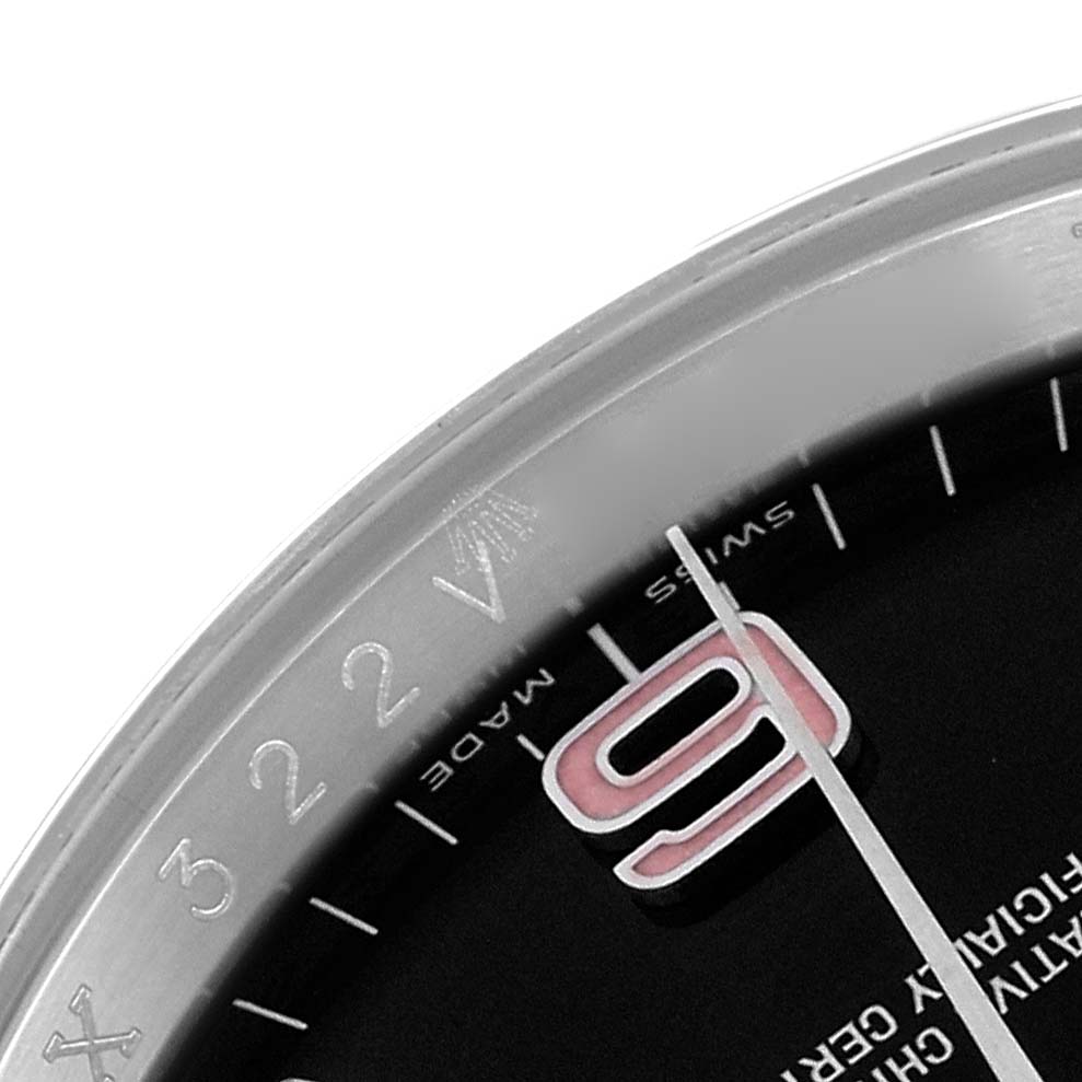 The image shows a close-up of the dial of a Rolex Oyster Perpetual 116000 Men's Stainless Steel Black Dial 116000 Men's Stainless Steel Black Dial, focusing on the numeral and part of the bezel.