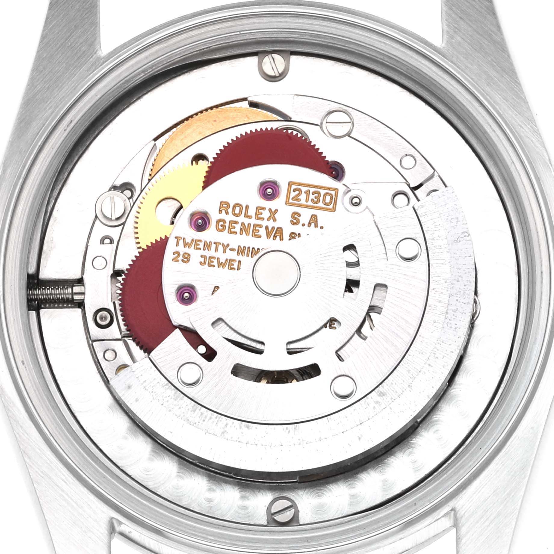This image shows the movement mechanism of a mid-size Rolex watch, showcasing gears and the "Rolex S.A. Geneva" branding.