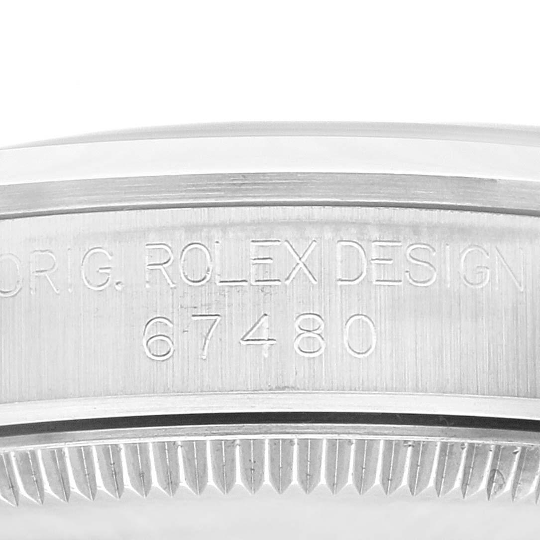 This image shows a close-up of the case engraving on a Mid-Size Rolex watch, displaying the text "ORIG. ROLEX DESIGN 67480".