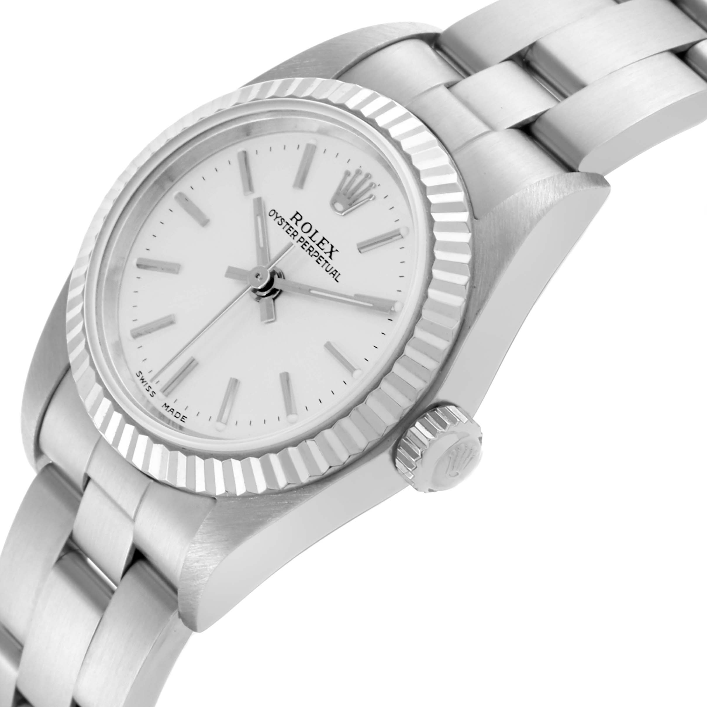 The Rolex Oyster Perpetual 76094 Women's Stainless Steel Silver Dial 76094 Women's Stainless Steel Silver Dial watch is shown at an angle highlighting the face, bezel, and part of the strap.