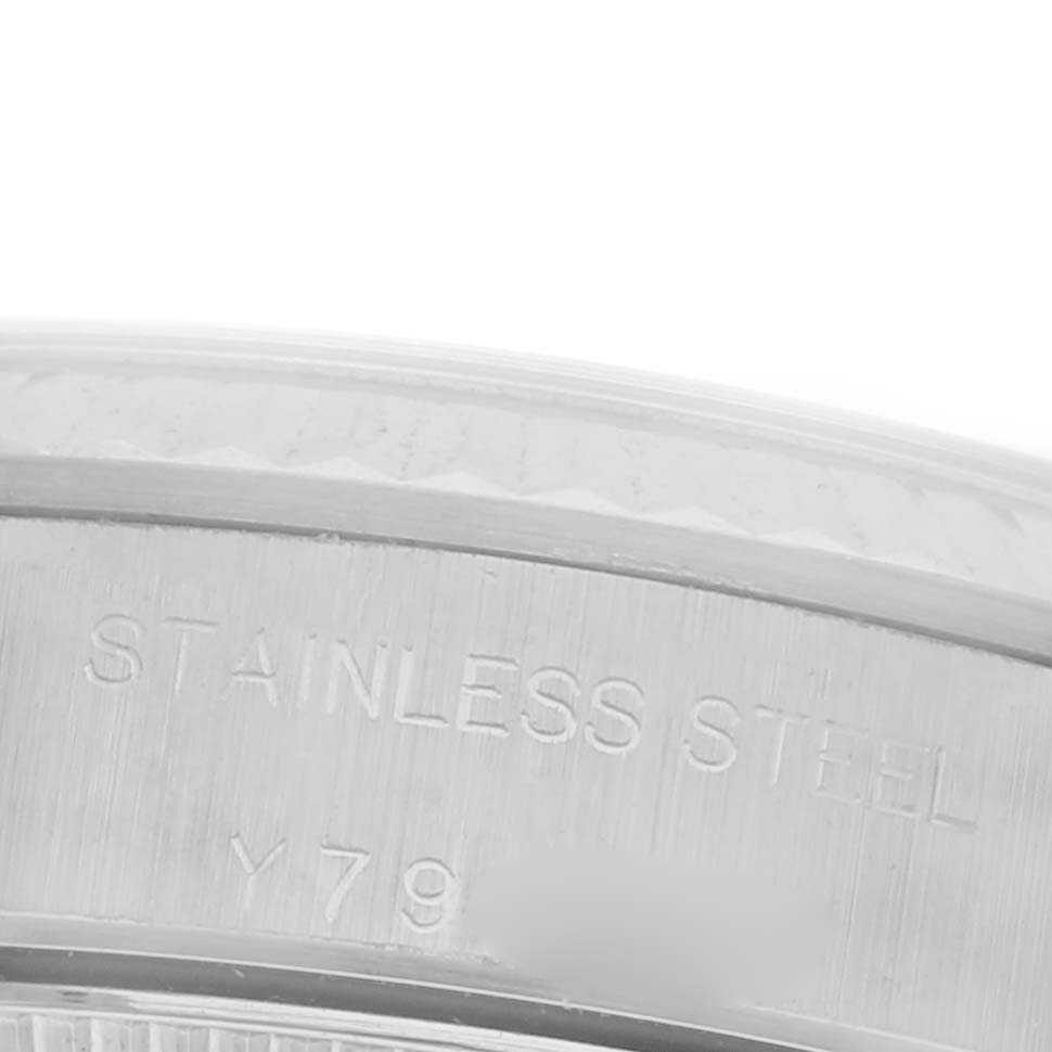 This image shows a close-up of the case back edge engraving on a Rolex Oyster Perpetual 76094 Women's Stainless Steel Silver Dial 76094 Women's Stainless Steel Silver Dial, highlighting "STAINLESS STEEL."