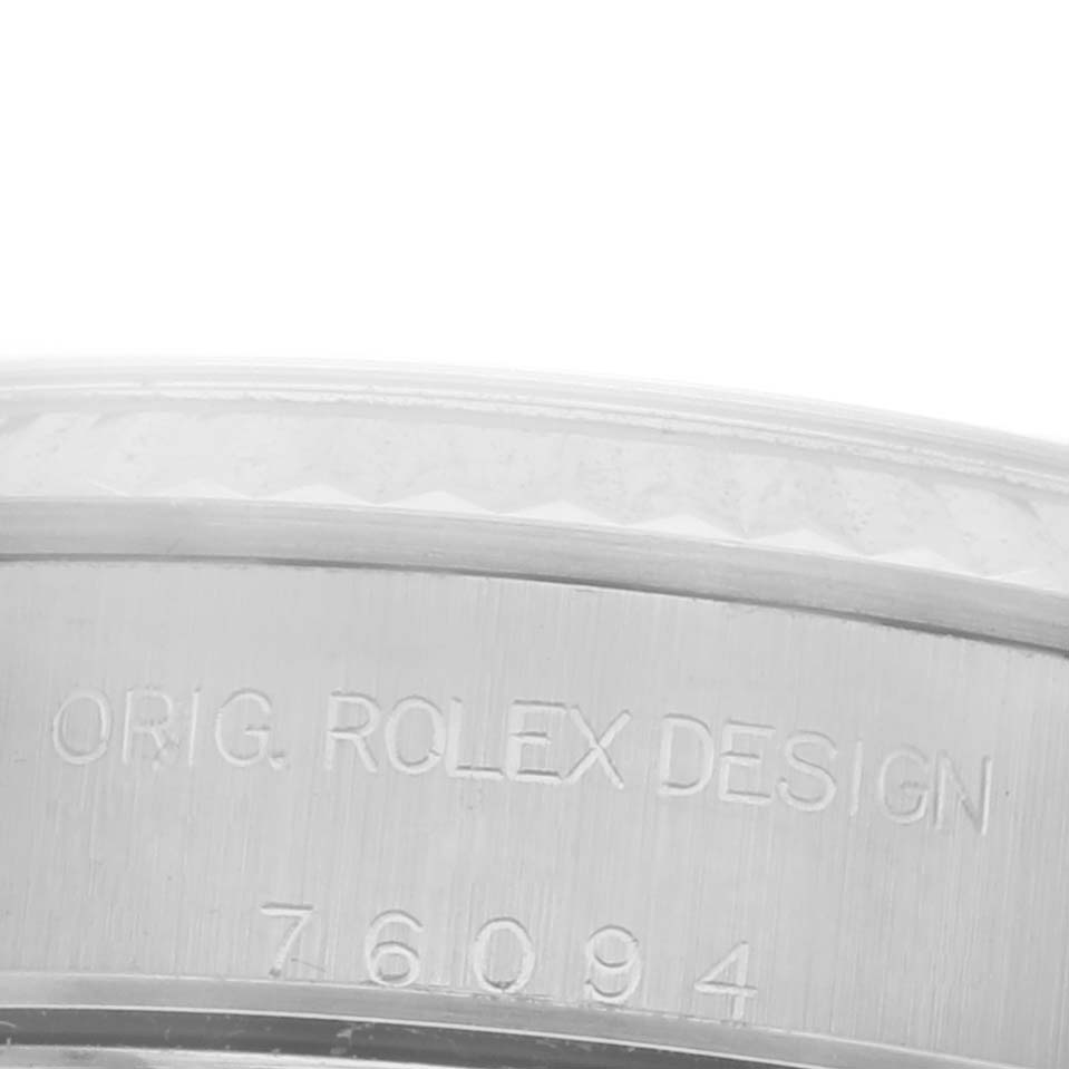 The image shows the side engraving on the case of a Rolex Oyster Perpetual 76094 Women's Stainless Steel Silver Dial 76094 Women's Stainless Steel Silver Dial watch.