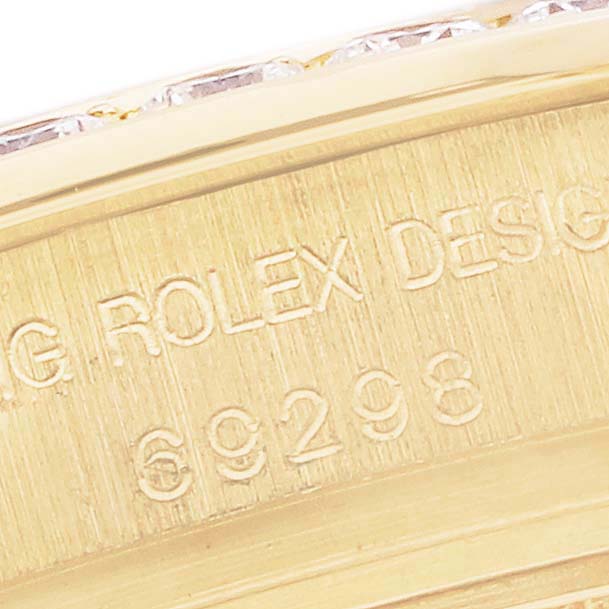 The image shows a close-up of the side view of a Rolex Pearlmaster 69298 Women's Yellow Gold Champagne Dial 69298 Women's Yellow Gold Champagne Dial watch, highlighting the engraved design number.