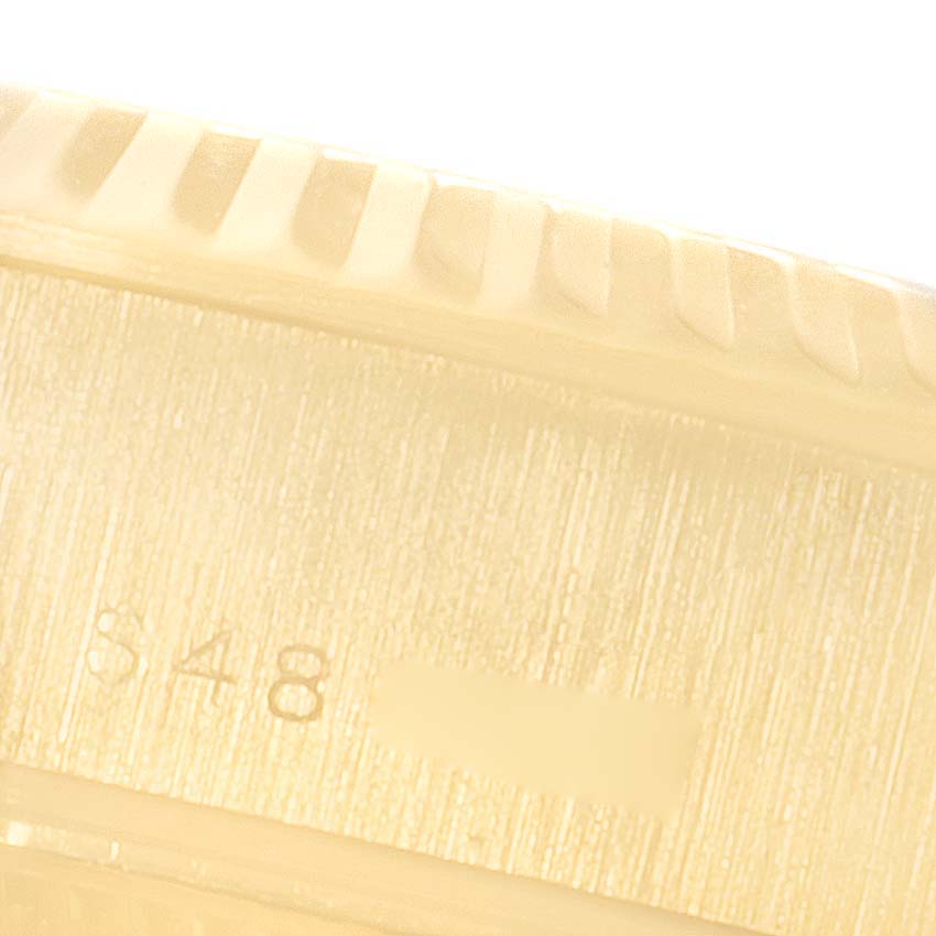 This image shows a close-up of the side engraving on a Rolex President 69178 Women's Yellow Gold Black Dial 69178 Women's Yellow Gold Black Dial model watch.