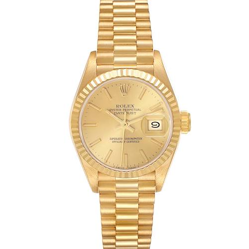 The Rolex President model is shown from a top-down angle, displaying its gold dial, fluted bezel, and President bracelet.