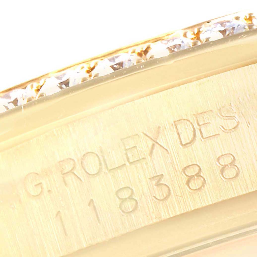 This image shows a close-up of the side inscription and diamond bezel of a Rolex President 118388 Men
s Yellow Gold Champagne Dial 118388 Men
s Yellow Gold Champagne Dial model watch.