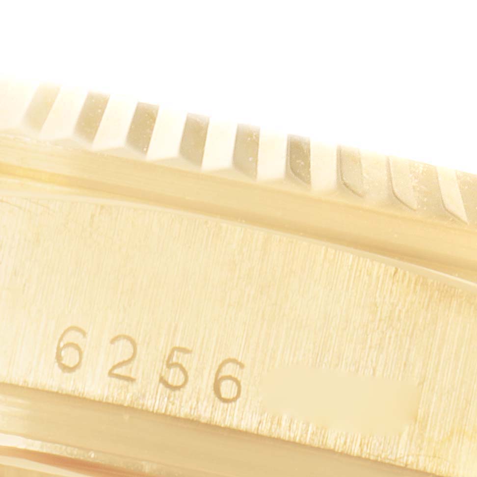 This close-up image shows the bezel and case with serial number 6256 of the Rolex President 18038 Men's Yellow Gold Champagne Dial 18038 Men's Yellow Gold Champagne Dial model watch.