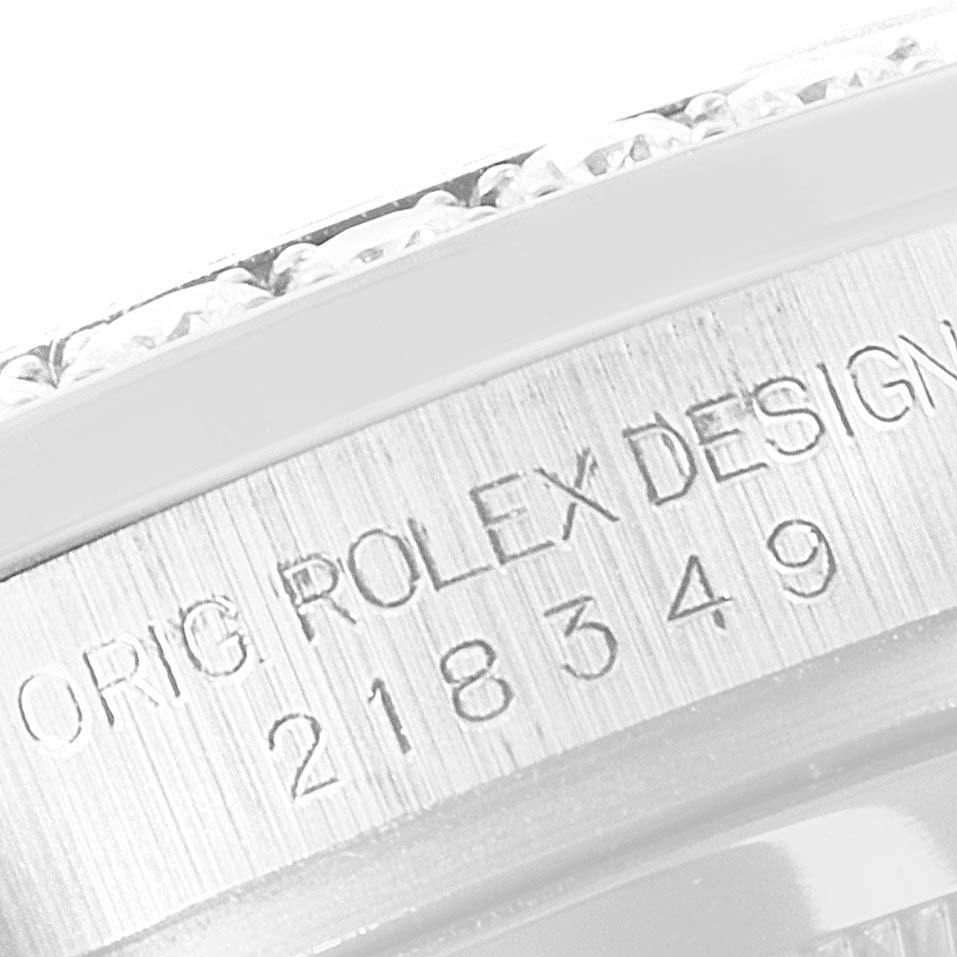 The image shows a close-up of the case side detailing and serial number of a Rolex President 218349 Men's White Gold Black Dial 218349 Men's White Gold Black Dial model watch.