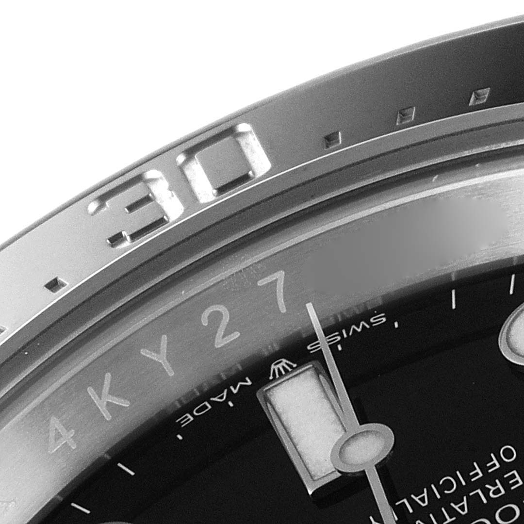 This image shows a close-up angle of the bezel, dial, and part of the minute hand of a Rolex Sea-Dweller 126600 Men
s Stainless Steel Black Dial 126600 Men
s Stainless Steel Black Dial watch.