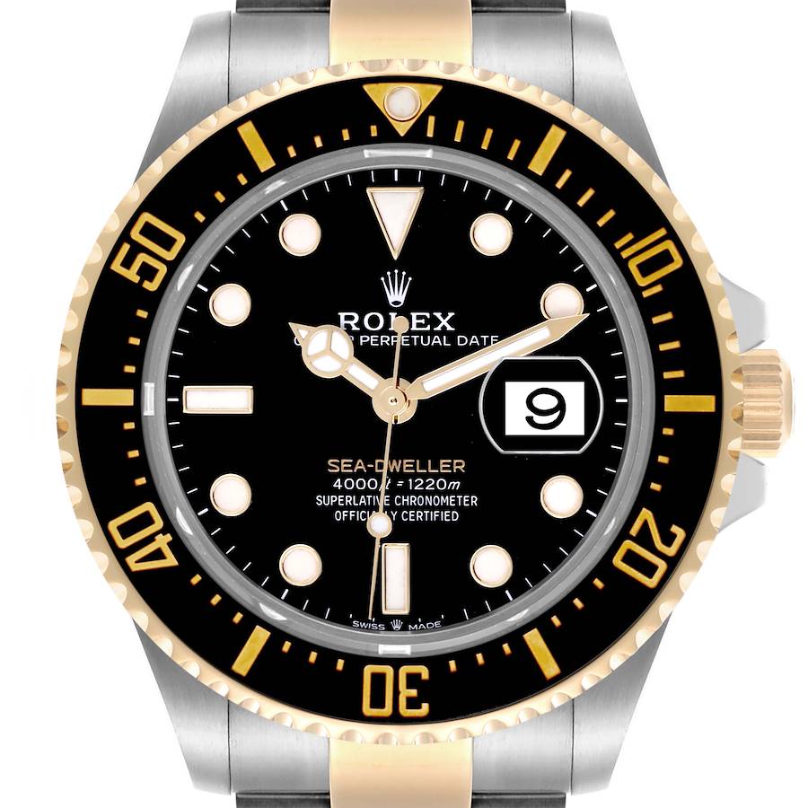 The Rolex Sea-Dweller watch is shown front-facing, highlighting the dial, bezel, and part of the bracelet.