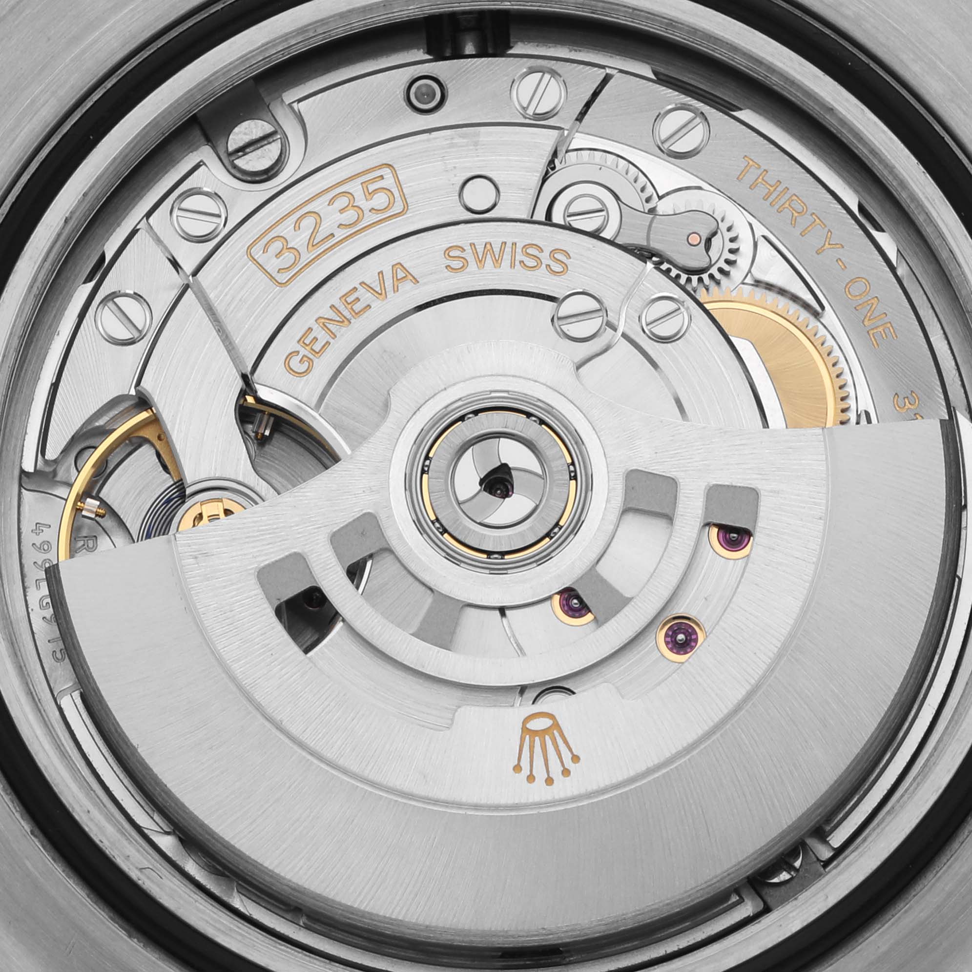 The image shows a close-up of the movement in the Rolex Sea-Dweller 126603 Men's Steel and Gold (two tone) Black Dial 126603 Men's Steel and Gold (two tone) Black Dial, highlighting its intricate gears and rotor mechanism.