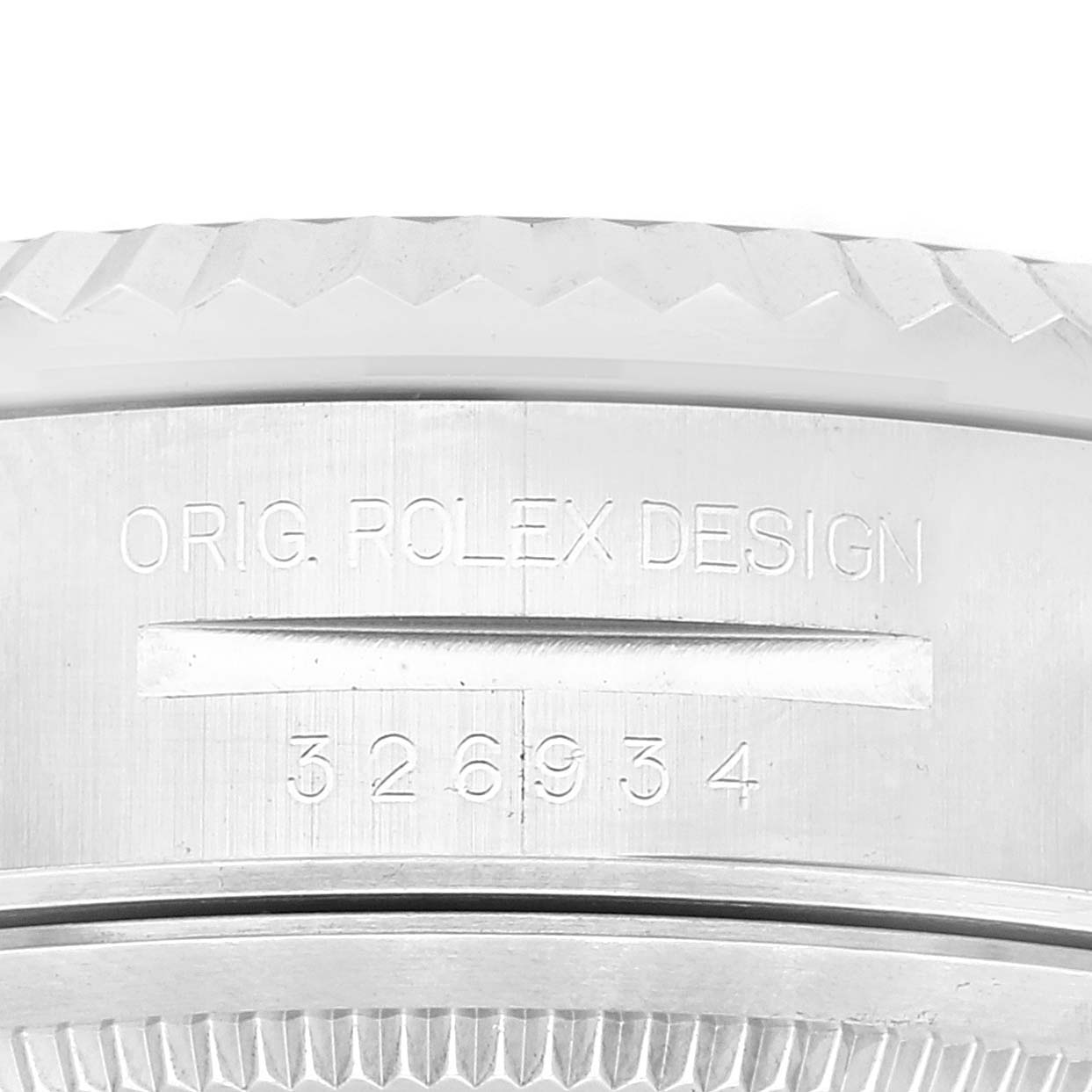 The image shows a close-up of the bezel and case with engraving on a Rolex Sky-Dweller 326934 Men's Stainless Steel Blue Dial 326934 Men's Stainless Steel Blue Dial watch from a side angle.